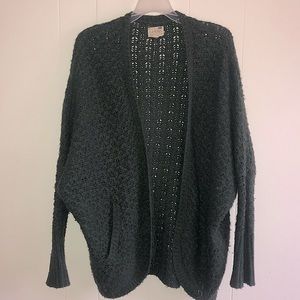 Open, dark green, knit cardigan